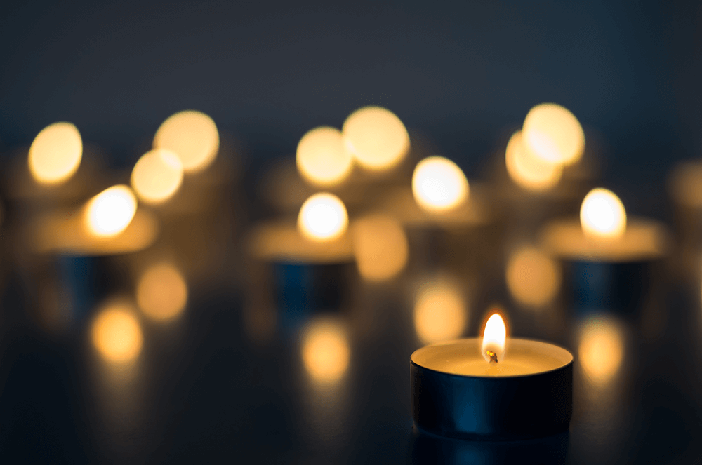 Group of tea light candles lit