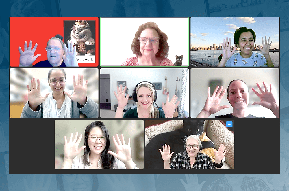 Group of people meeting on Zoom showing off jazz hands