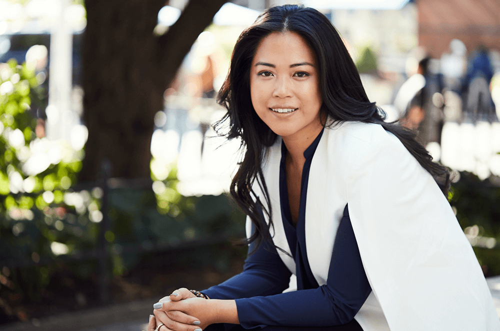 2024 Toastmasters Golden Gavel recipient Lisa Sun posing in blue and white outfit outdoors