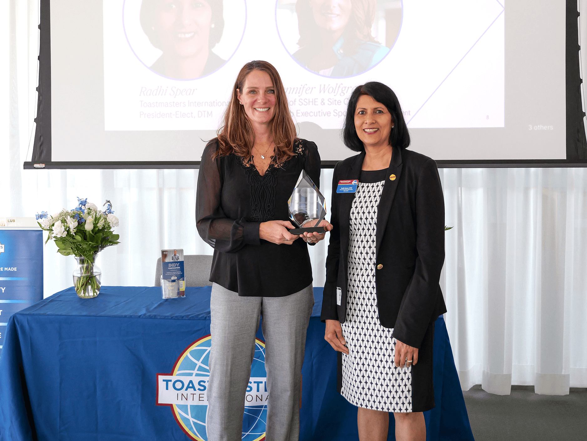 Spear presents Jennifer Wolfgram with a corporate recognition award at Roche Diagnostics in Indianapolis, Indiana.