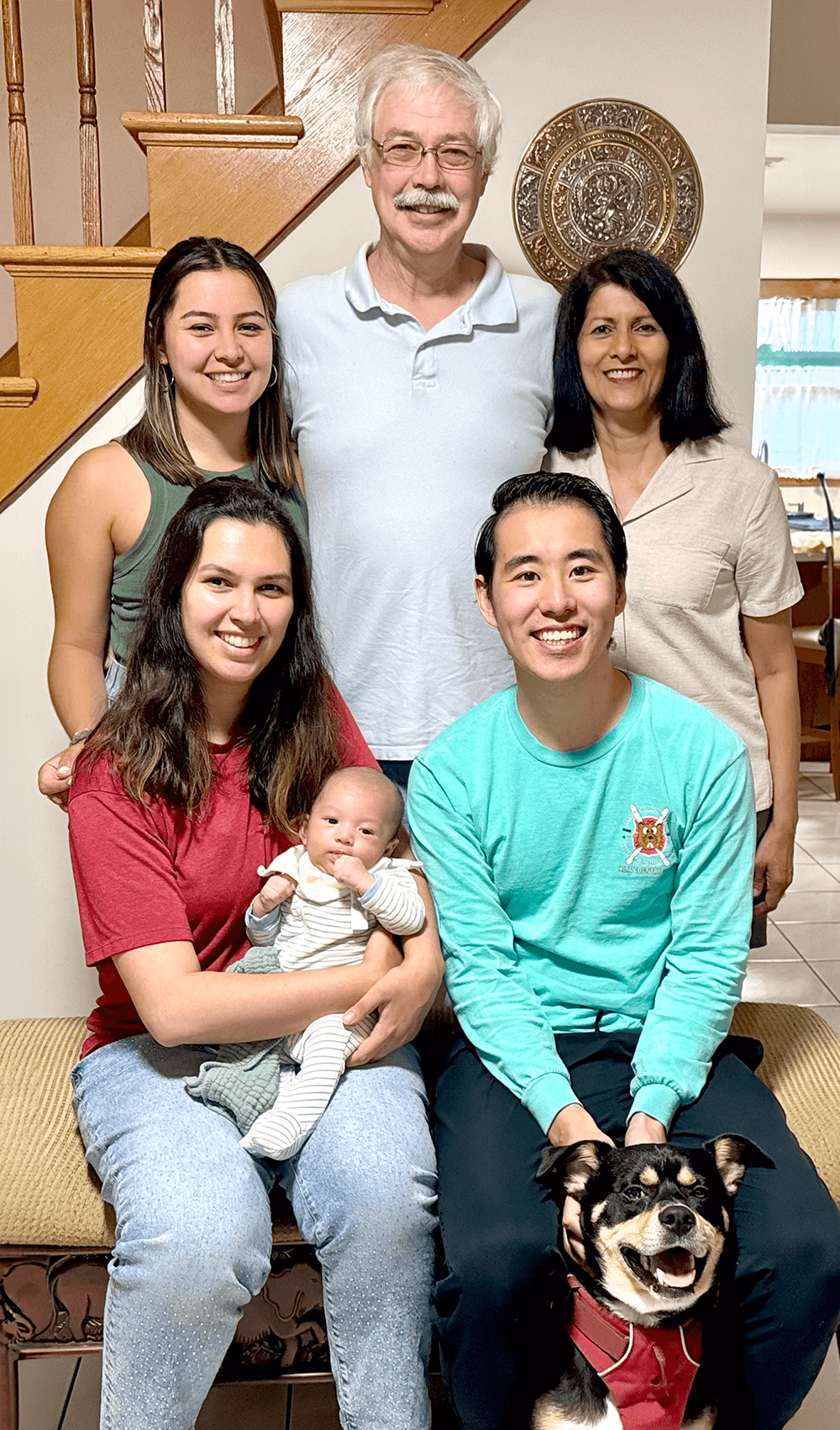 Spear with her husband, two daughters, son-in-law, grandson, and “grandpup.”