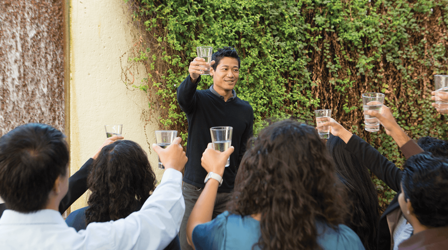 Man toasting a crowd