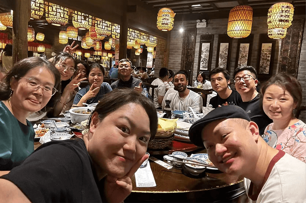 Group of people gathered at dinner table