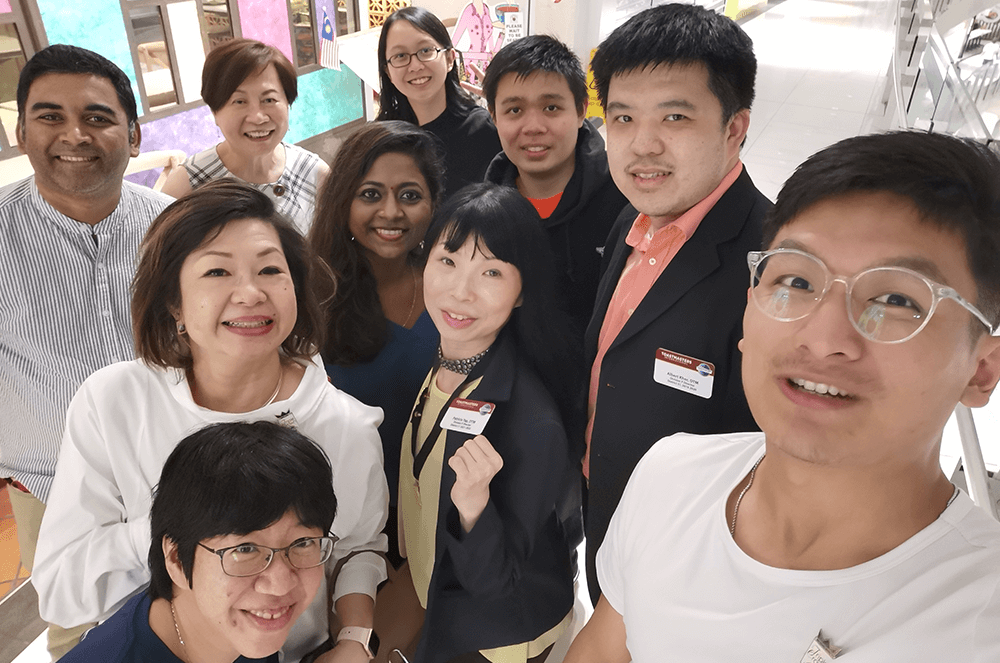 Group of 10 people taking selfie