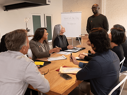 Man standing up speaking to group