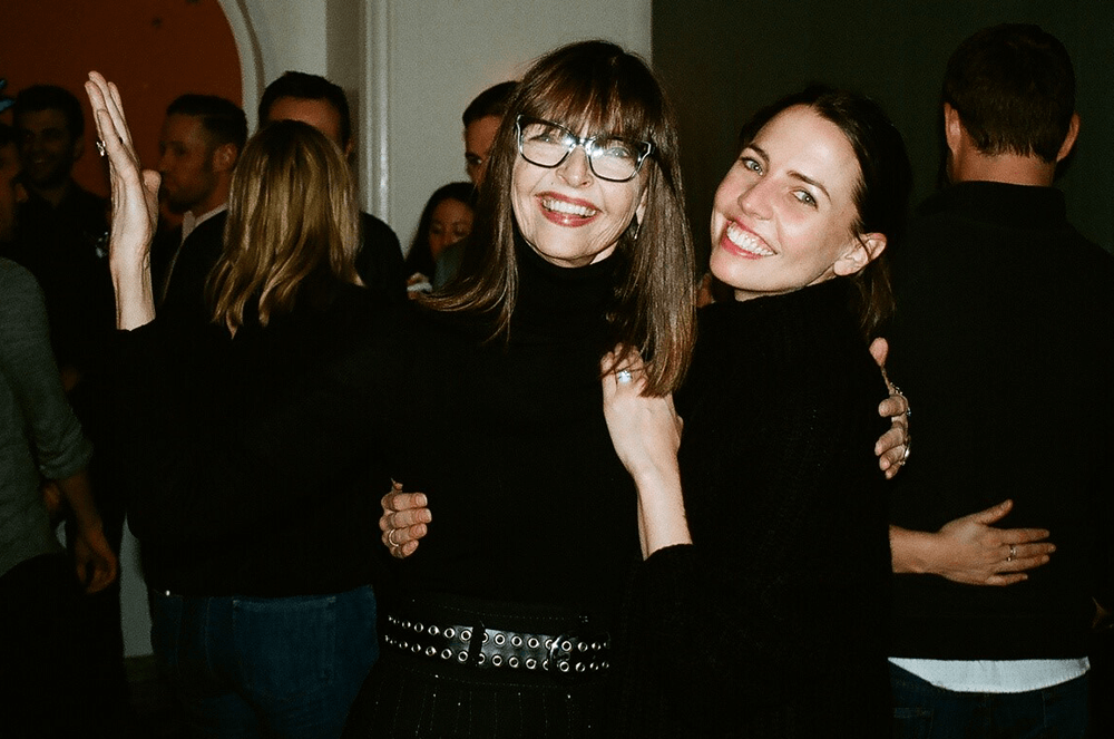 Mother and daughter posing together