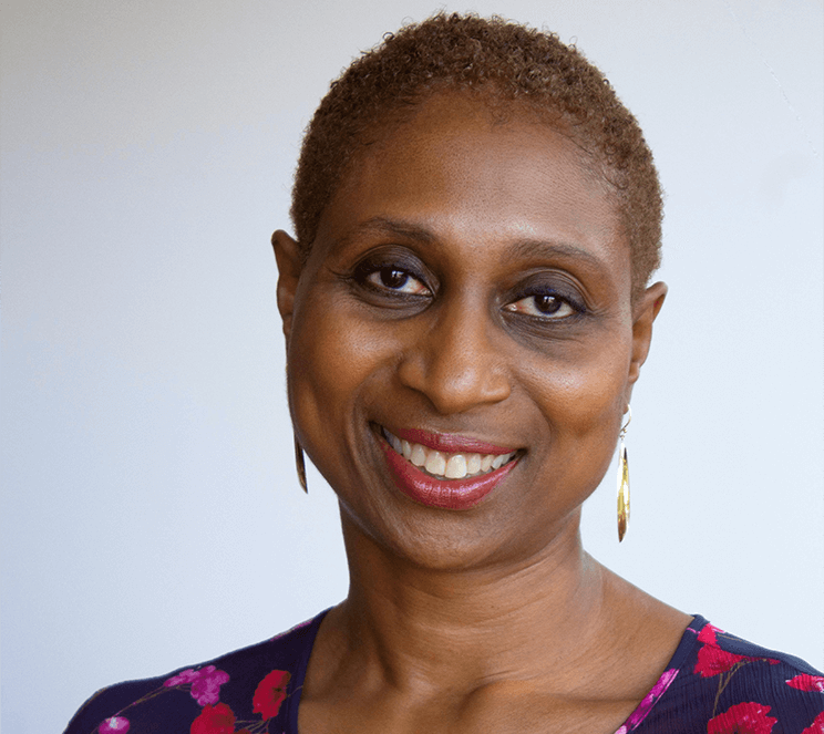 Woman in flowered blouse smiling