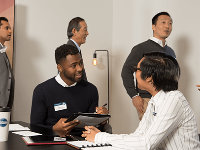 Man at table evaluating someone