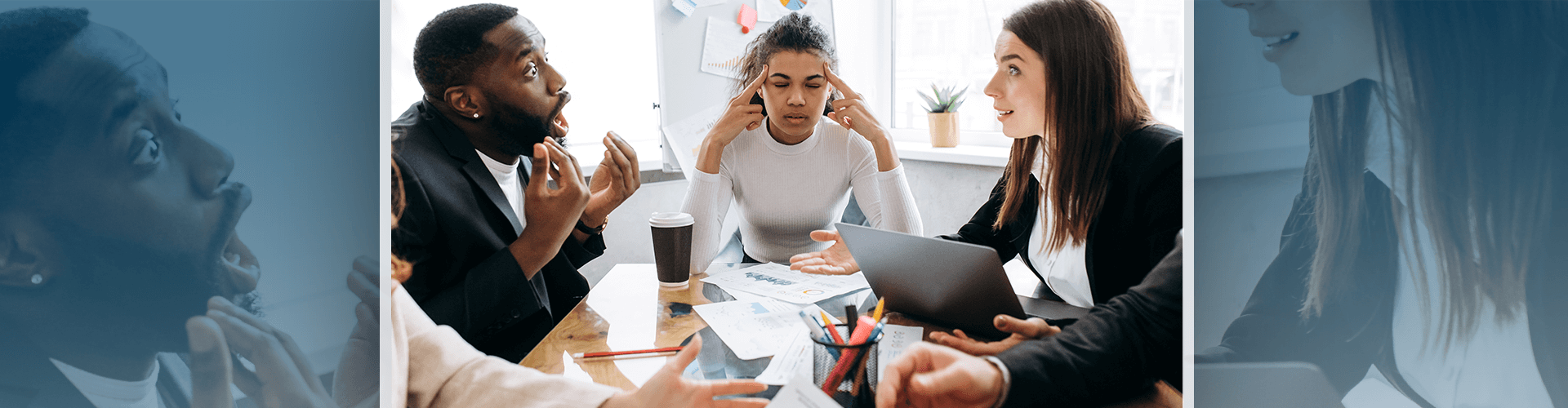 Three coworkers arguing at table