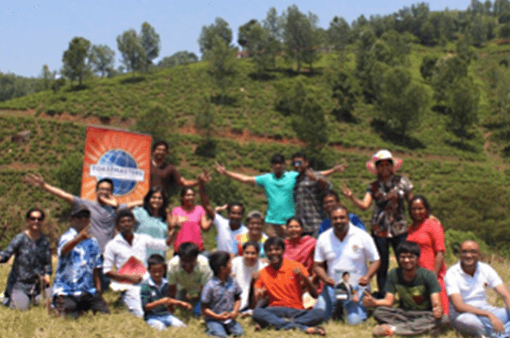 Members of Coimbatore Toastmasters Club, along with their family members, hold an outdoor meeting in Coonoor, a hill station near Coimbatore, Tamil Nadu, India, in 2017.