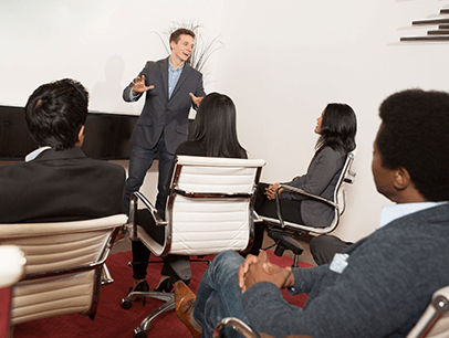 Man speaking to group of people