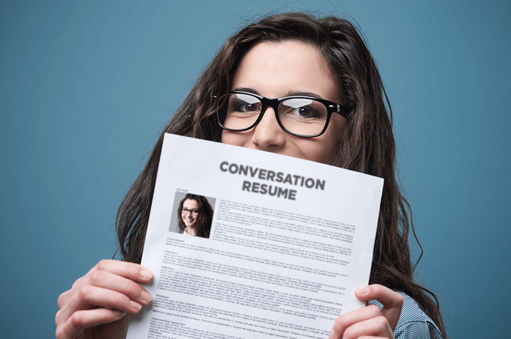 Woman holding a conversation resume document