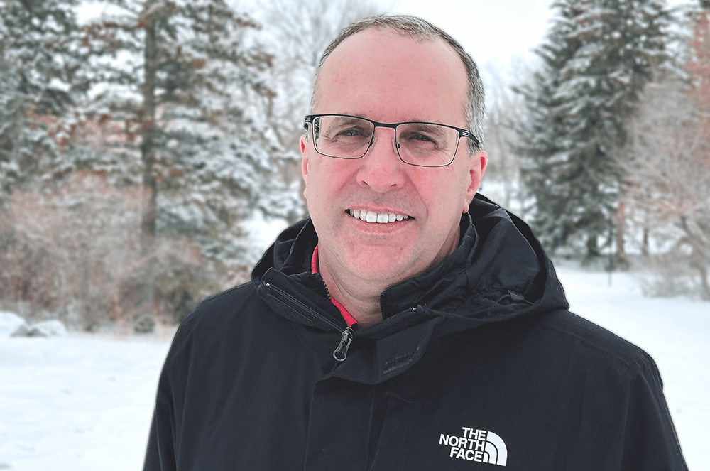 Man in black jacket outdoors in snow