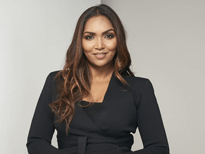 Woman posing in black suit