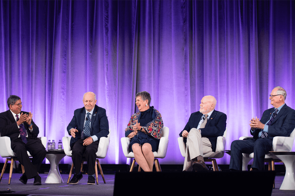 Past Toastmasters International Presidents and Distinguished Toastmasters Dilip Abayasekara, Ted Corcoran, Pat Johnson, Tim Keck, and Neil Wilkinson (who moderated) gather onstage for a special panel session at the 2024 Convention.