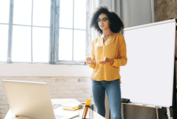 Woman standing in front of white board