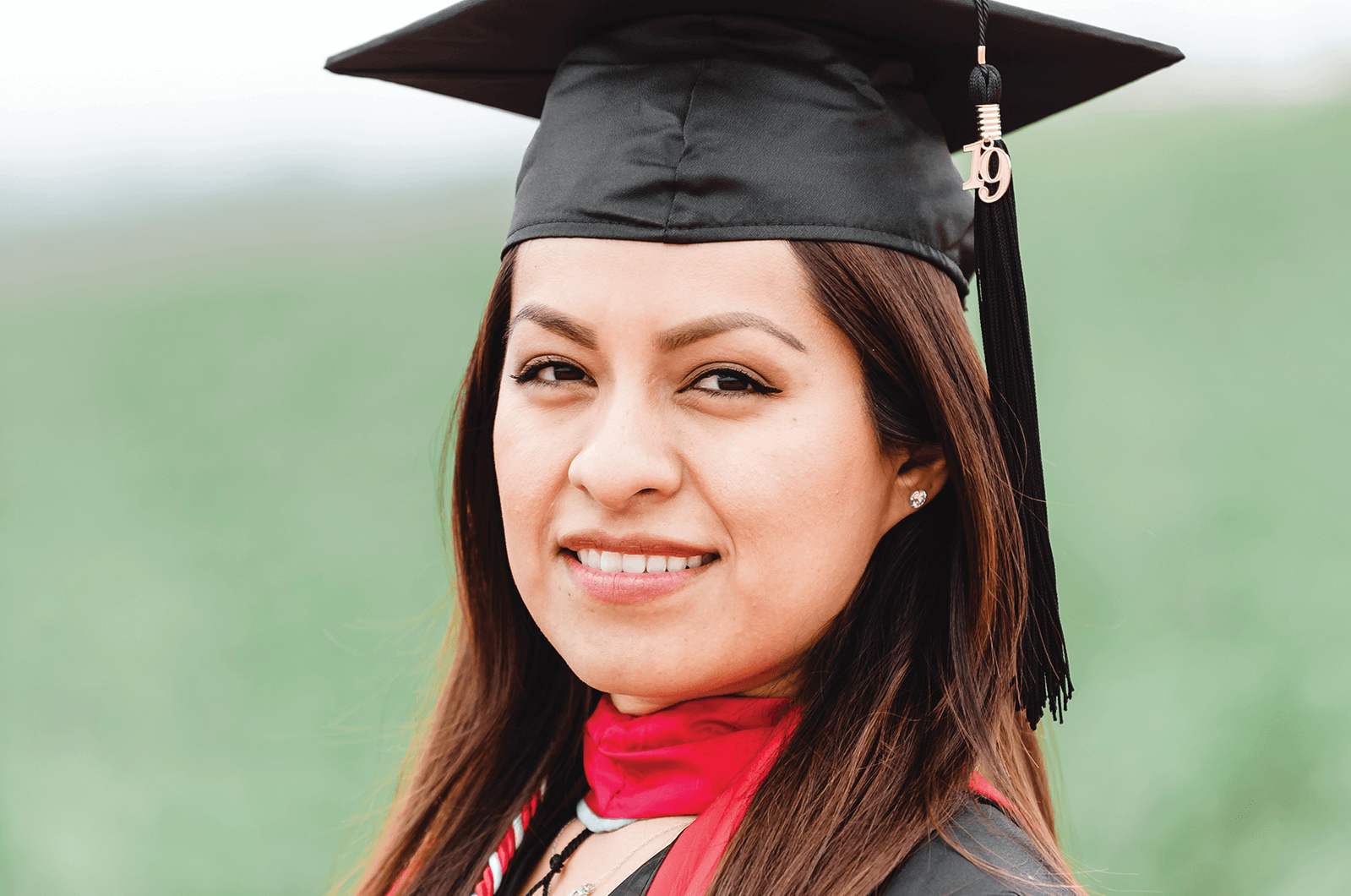 Woman posing in cap and gown