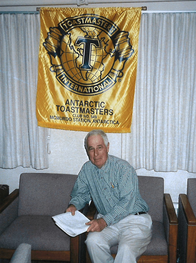 John Donnellon sits underneath the Antarctica club banner (with older branding), from when he was a member of the unique club in the 1990s.