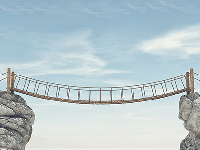 Image of a bridge reaching across two rocks