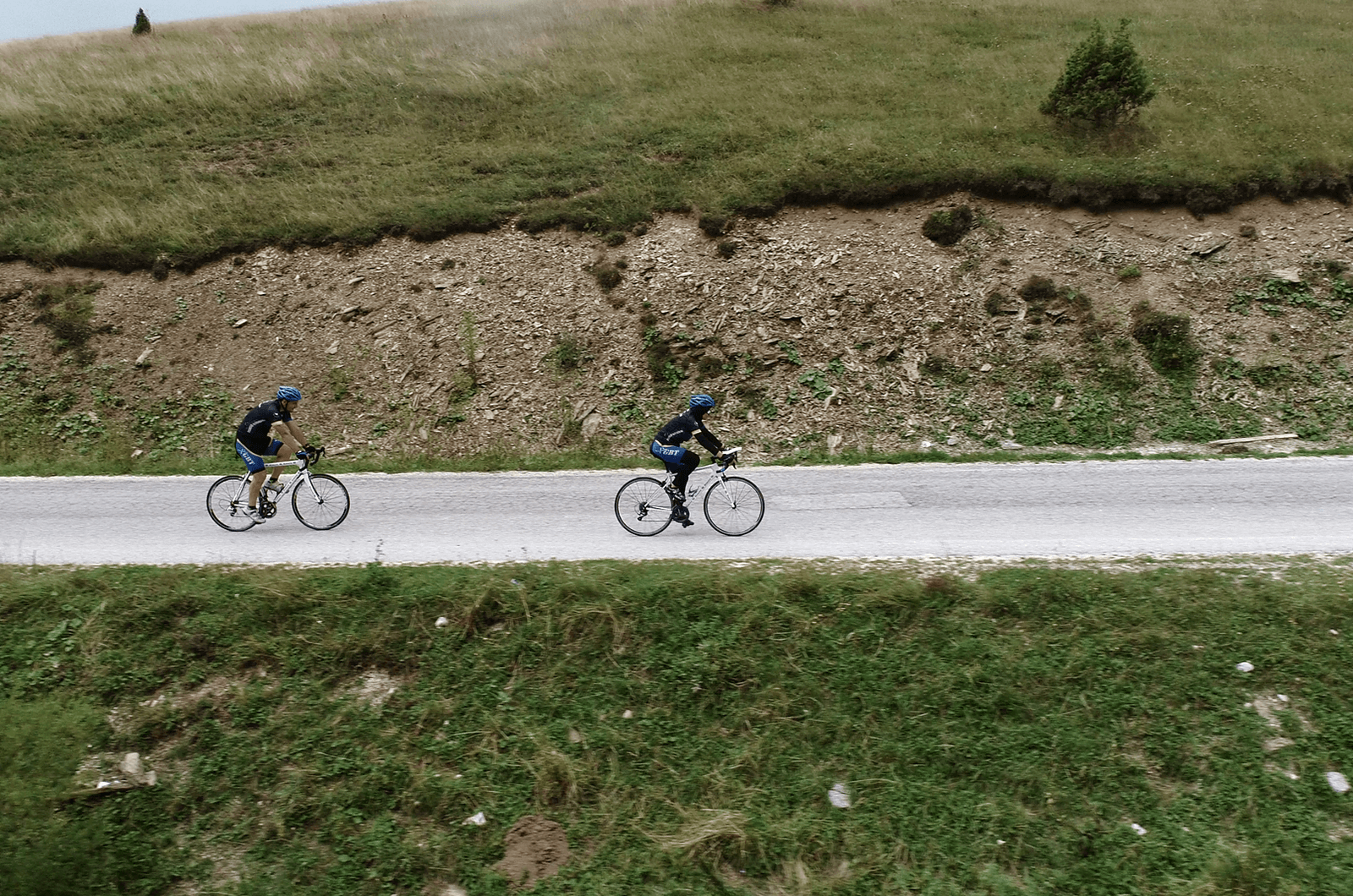 Softić (right), rides her bicycle during a triathlon. 