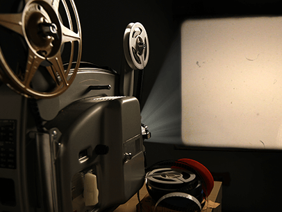 Movie reel showing light on a screen