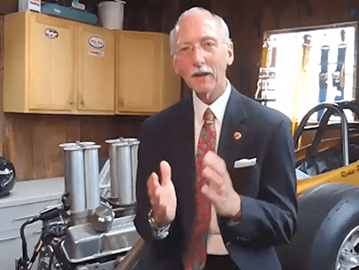 Toastmasters International President Richard E. Peck speaking in his garage